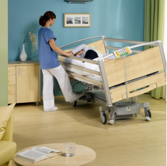image shows nurse using the Latera adjustable bed 